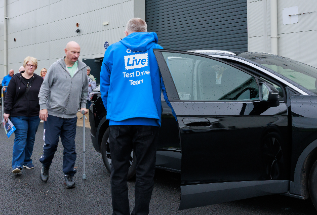 Visitors to Motability Scheme Live about to take a test drive with a driving instructor